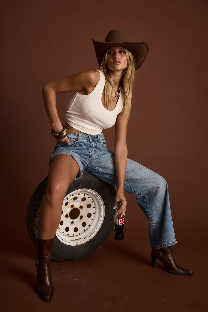 Eastwood Light One Legged Boyfriend Jeans paired with complementary accessories for a polished look.