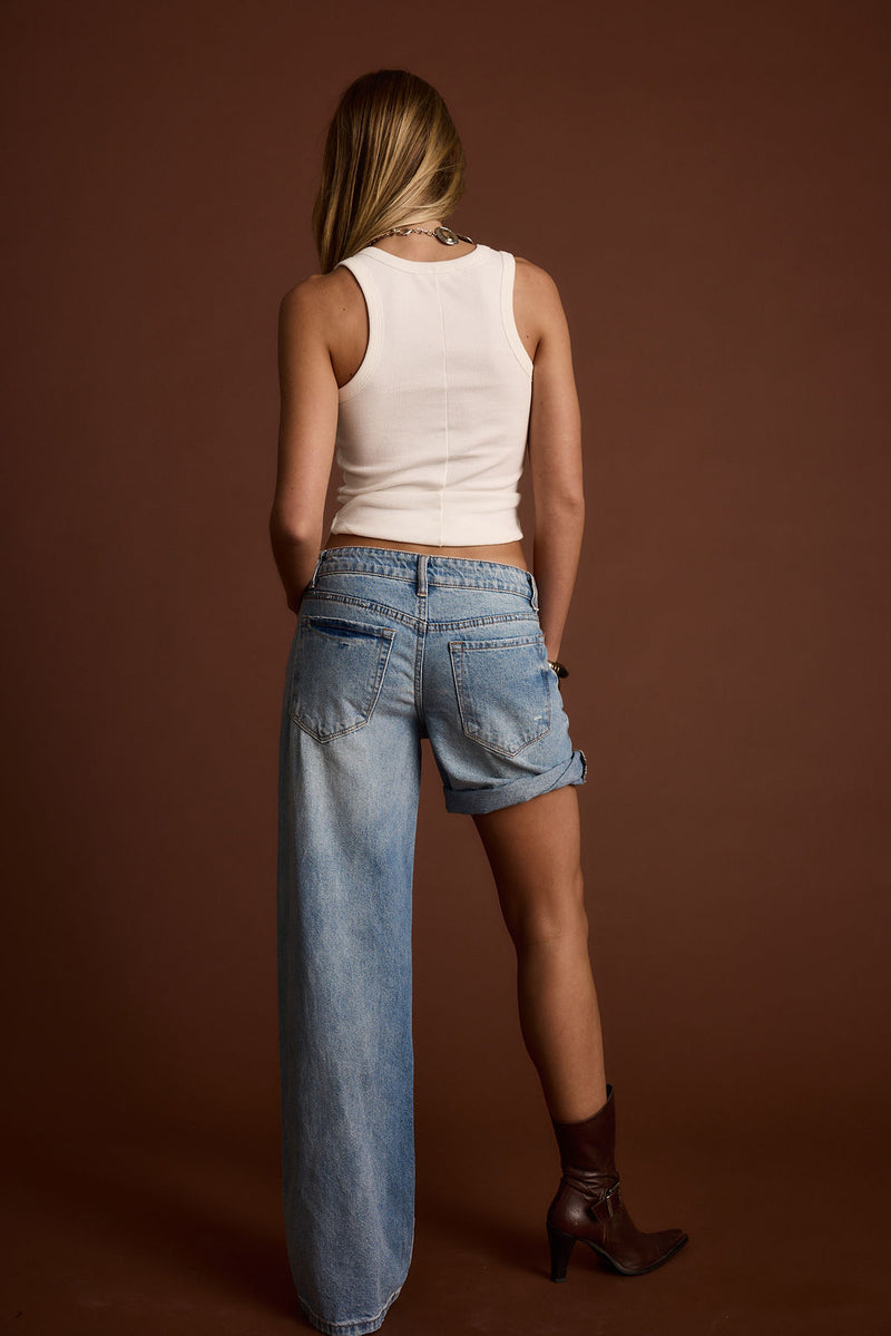 Detail shot of the Eastwood Light One Legged Boyfriend Jeans highlighting the design elements.