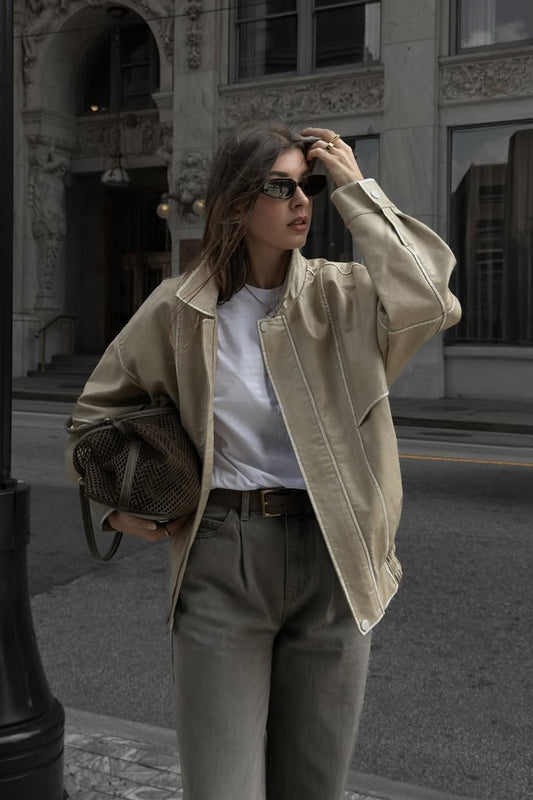 Faux leather and leather oversized jacket with accents and a flattering silhouette.